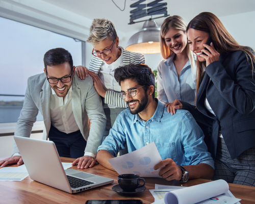 business people reviewing labtop